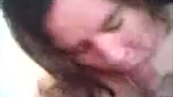 Chubby brunette blowing cock