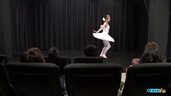 The skilled asian dancer performs for her audience exuding delight