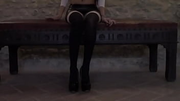 Milf with beautiful legs stockings and high heelsi'm sitting on a sofa with a leather miniskirt a pair of knee highs