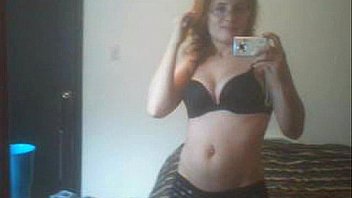 Redhead lily cooper caressing her soft body in front of the mirror