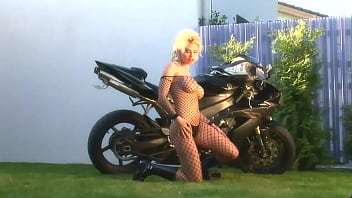 Blonde Bombshell Caylian Curtis Is A Biker's Dream In Fishnet Solo Scene thumbnail
