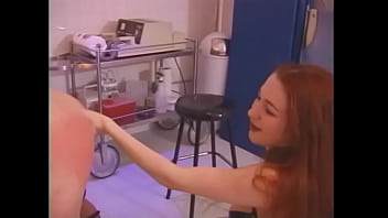 Busty chick with long red hair spanks tied up tattooed guy's ass