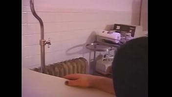 Busty chick with long red hair spanks tied up tattooed guy's ass