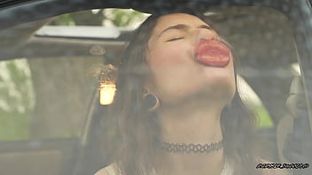 Messy pink lipgloss marks on the car window