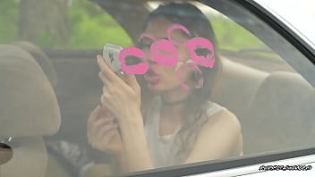 Messy pink lipgloss marks on the car window