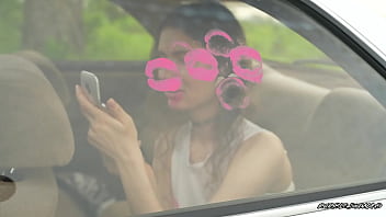 Messy pink lipgloss marks on the car window