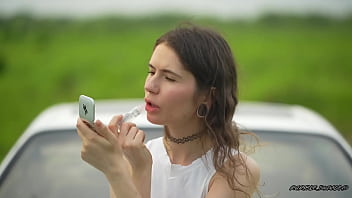 Messy pink lipgloss marks on the car window