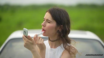 Messy pink lipgloss marks on the car window