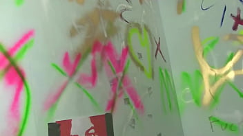 Tattoed girl blowing gloryhole cock