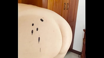 Hot wax is dripping onto my ass