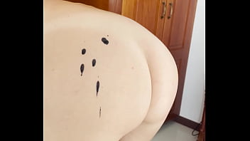 Hot wax is dripping onto my ass