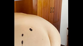 Hot wax is dripping onto my ass