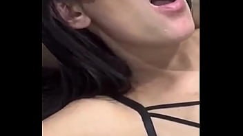 Young girl giving kisses to the muscular guy