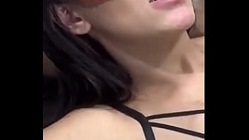 Young girl giving kisses to the muscular guy