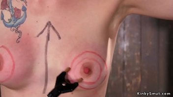 Blindfolded brunette slave gets strapped on the floor