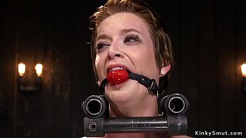 Blindfolded brunette slave gets strapped on the floor