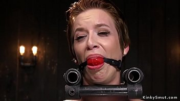 Blindfolded brunette slave gets strapped on the floor