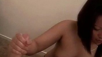 Asian sex teen giving expert handjob