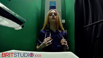 Horny nurse sucks cock at the gloryhole