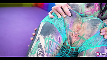 Tattooed babe straps on a huge toy for the slutty girl