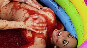 Romana ryder and tammie lee rub their naked bodies together in a jam bath