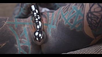 Anuskatzz gets a stainless steel dildo to shove up her ass