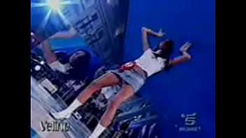 Hot italian beauty shows upskirt as she dances during a performance