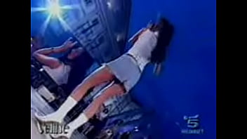 Hot italian beauty shows upskirt as she dances during a performance