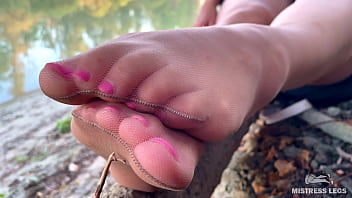 Sex feet teasing in pantyhose outdoor