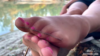 Sex feet teasing in pantyhose outdoor