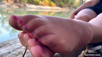 Sex feet teasing in pantyhose outdoor