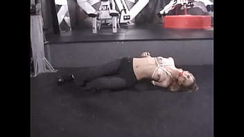 Horny mistress teases her half naked sex slave babe in a dungeon