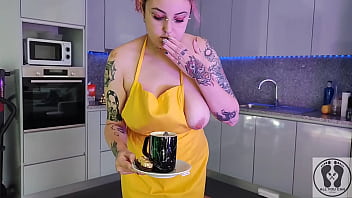 Chubby waitress masturbates in the kitchen wearing an apron