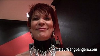 Mature redhead takes two together in her pussy