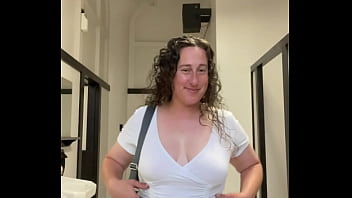 Curvy milf exposes big breasts in downtown