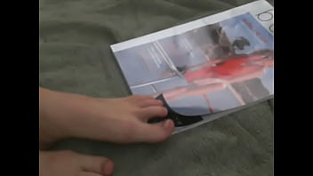 Flipping Through Magazine With Feet thumbnail