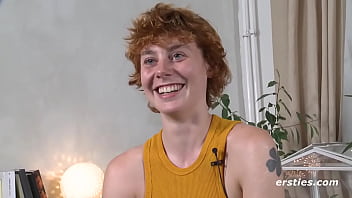 Redhead girl plays with her favorite toy