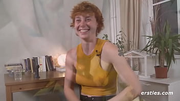 Redhead girl plays with her favorite toy