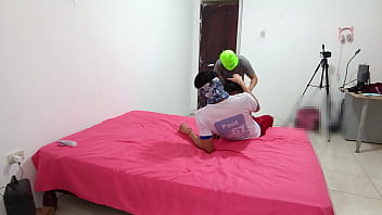 The indian woman flirts with two men while filming her porn scene and fucks with a skin colored dildo