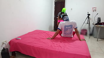 The indian woman flirts with two men while filming her porn scene and fucks with a skin colored dildo