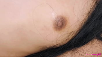 Captivating dark haired beauty naked close up