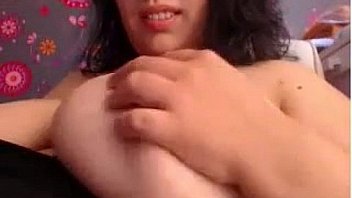 Chubby chick shows off her very large breasts