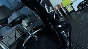 Solo 1 showcasing studio black latex catsuit and huge red cobra strap on