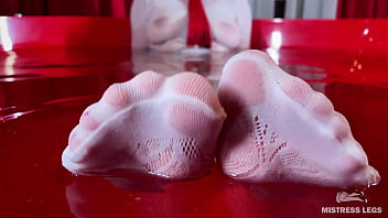 I sat on the edge of bath tub in cute white fishnets and stretch my legs to you face