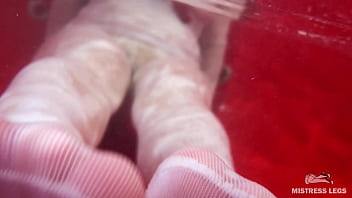 I sat on the edge of bath tub in cute white fishnets and stretch my legs to you face