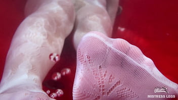 I sat on the edge of bath tub in cute white fishnets and stretch my legs to you face