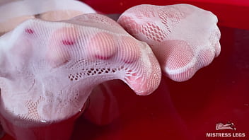 I sat on the edge of bath tub in cute white fishnets and stretch my legs to you face