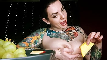 Hot horny tattooed bitch sexy eating fruit and pouring sweet yogurt on her boobs
