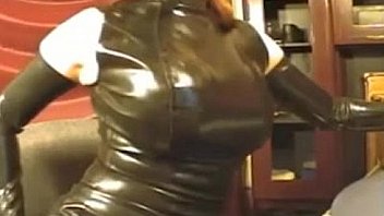 Girl in latex tight dress and mask on webcam