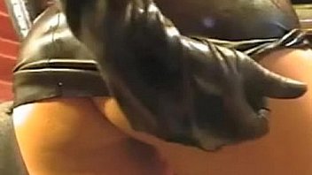 Girl in latex tight dress and mask on webcam